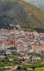 Preview wallpaper buildings, city, valley, mountain, trees