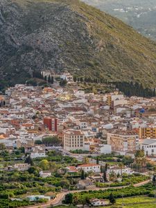 Preview wallpaper buildings, city, valley, mountain, trees