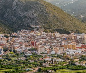 Preview wallpaper buildings, city, valley, mountain, trees