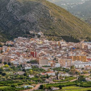 Preview wallpaper buildings, city, valley, mountain, trees