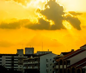 Preview wallpaper buildings, clouds, sunlight, rays, city
