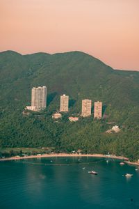 Preview wallpaper buildings, coast, forest, sea