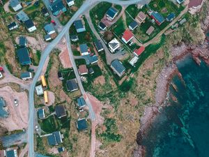 Preview wallpaper buildings, coast, sea, aerial view, road, winding