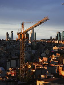 Preview wallpaper buildings, construction crane, city, evening