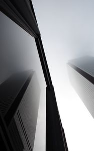 Preview wallpaper buildings, facades, bottom view, fog, black and white
