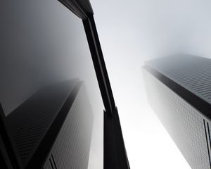 Preview wallpaper buildings, facades, bottom view, fog, black and white