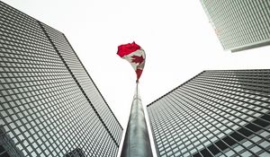 Preview wallpaper buildings, flagpole, flag, architecture, skyscrapers