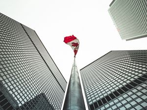 Preview wallpaper buildings, flagpole, flag, architecture, skyscrapers