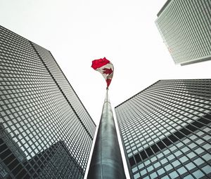 Preview wallpaper buildings, flagpole, flag, architecture, skyscrapers