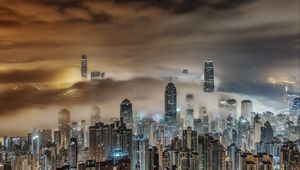 Preview wallpaper buildings, fog, skyscrapers, city, night