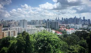 Preview wallpaper buildings, houses, city, trees, clouds, sky