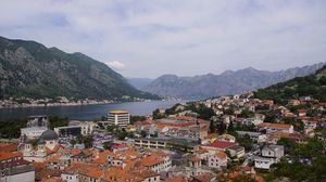 Preview wallpaper buildings, houses, mountains, river, city