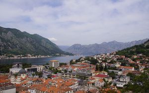 Preview wallpaper buildings, houses, mountains, river, city