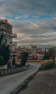 Preview wallpaper buildings, houses, road, mountains, city