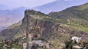 Preview wallpaper buildings, houses, rocks, cliff, mountains