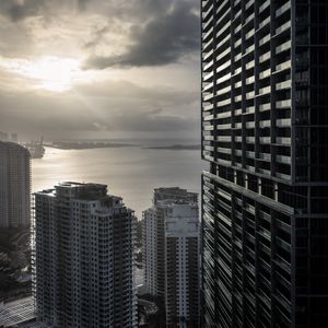 Preview wallpaper buildings, houses, sea, city, aerial view, black and white