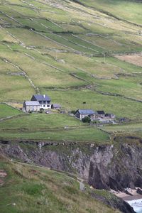 Preview wallpaper buildings, houses, slope, field, cliff