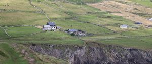 Preview wallpaper buildings, houses, slope, field, cliff