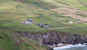 Preview wallpaper buildings, houses, slope, field, cliff