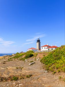 Preview wallpaper buildings, lighthouse, slope, grass, sky