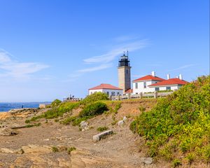 Preview wallpaper buildings, lighthouse, slope, grass, sky