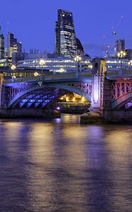 Preview wallpaper buildings, lights, city, bridge, river, evening