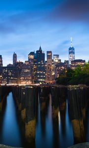 Preview wallpaper buildings, lights, city, pilings, evening