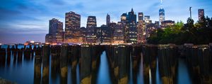 Preview wallpaper buildings, lights, city, pilings, evening