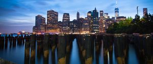 Preview wallpaper buildings, lights, city, pilings, evening