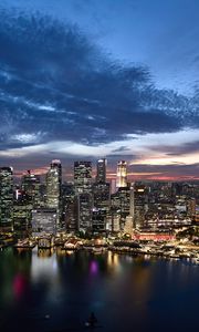 Preview wallpaper buildings, lights, lake, city, evening