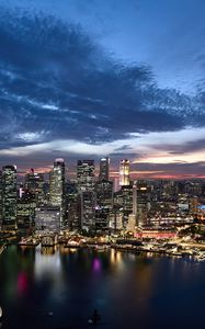 Preview wallpaper buildings, lights, lake, city, evening