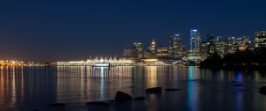 Preview wallpaper buildings, lights, river, reflection, stones, night, city