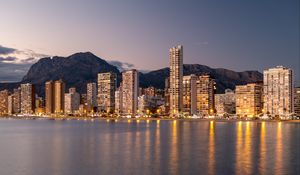 Preview wallpaper buildings, lights, sea, mountains, city, twilight