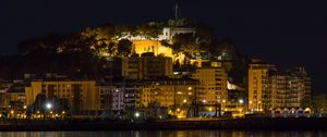 Preview wallpaper buildings, lights, sea, embankment, night