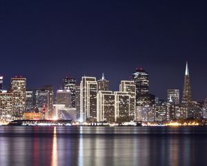 Preview wallpaper buildings, night, light, lights, reflection, river, water, houses, sky