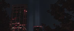 Preview wallpaper buildings, night, rays, light, city