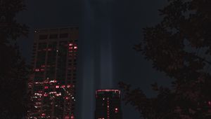 Preview wallpaper buildings, night, rays, light, city