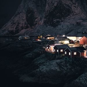 Preview wallpaper buildings, night, rocks, settlement