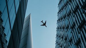 Preview wallpaper buildings, plane, sky, bottom view