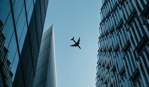 Preview wallpaper buildings, plane, sky, bottom view