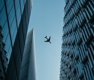 Preview wallpaper buildings, plane, sky, bottom view
