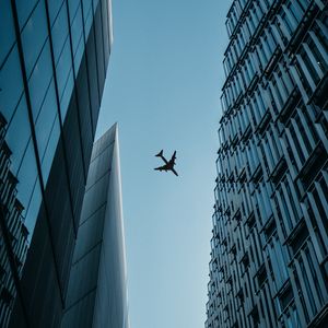 Preview wallpaper buildings, plane, sky, bottom view
