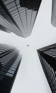 Preview wallpaper buildings, plane, sky, skyscrapers