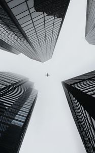 Preview wallpaper buildings, plane, sky, skyscrapers