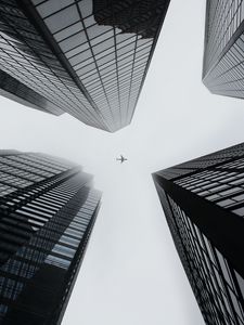 Preview wallpaper buildings, plane, sky, skyscrapers