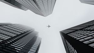 Preview wallpaper buildings, plane, sky, skyscrapers