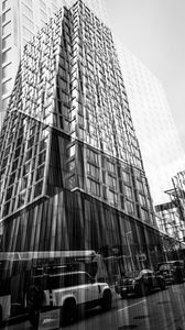 Preview wallpaper buildings, reflection, street, cars, edges, bw
