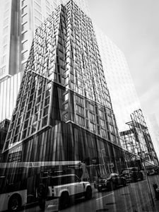 Preview wallpaper buildings, reflection, street, cars, edges, bw