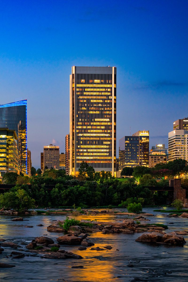 800x1200 Wallpaper buildings, river, bridge, light, city, dark
