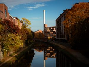 Preview wallpaper buildings, river, pipe, sky, trees, reflection